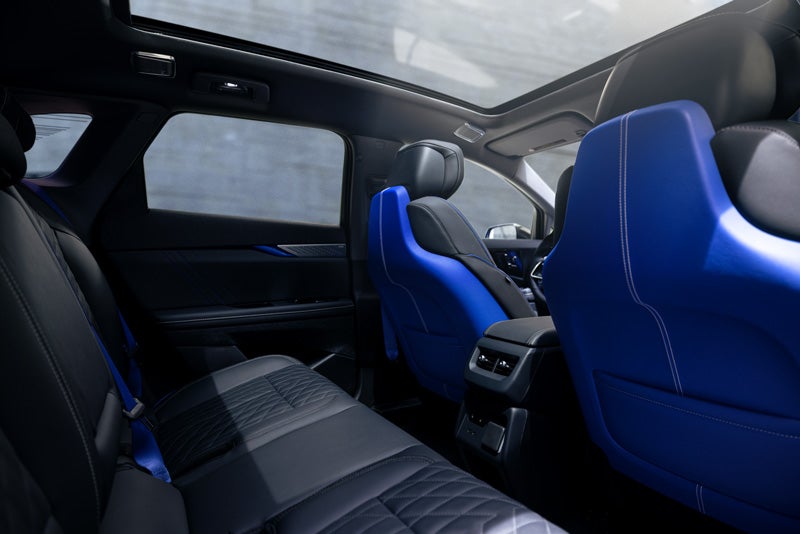 Back Seat View of the 2026 OPTIQ-V Blue Front Seats, Sun Roof, and Interior | Leachman Cadillac in Bowling Green KY